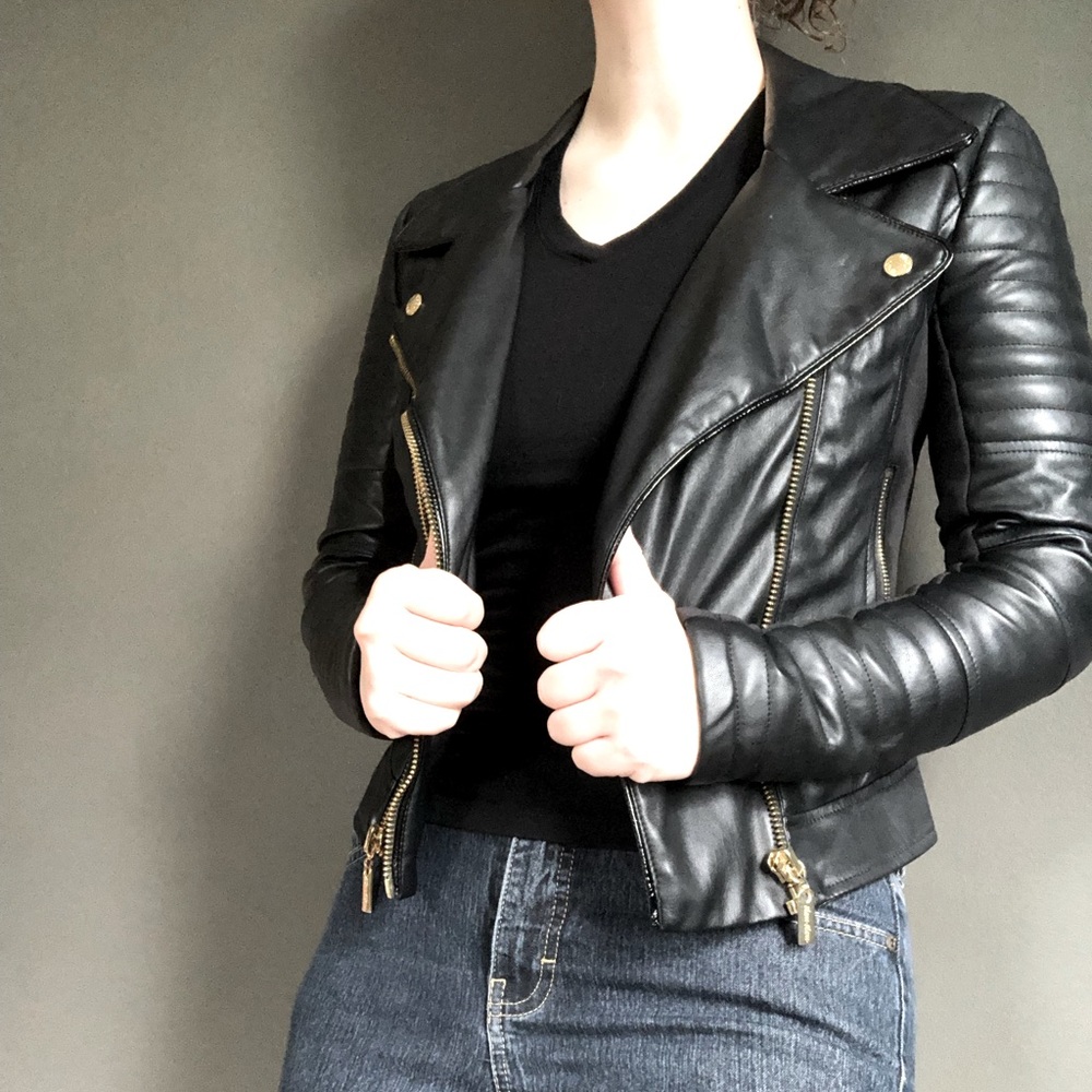 XS black faux leather moto jacket with gold accents